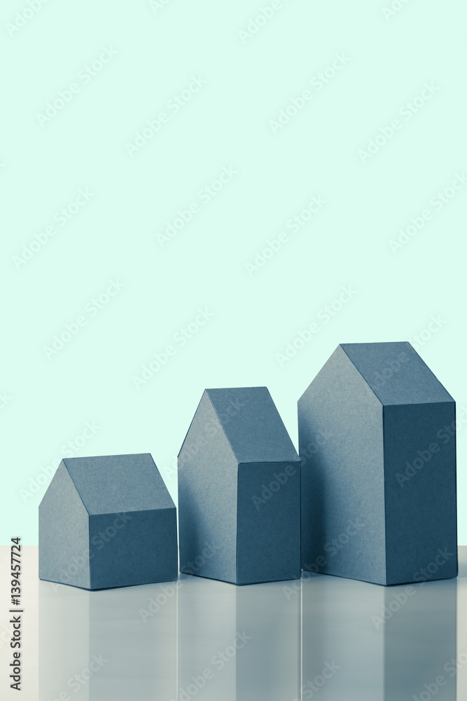 three house model cardboard with free copyspace house loan business concept