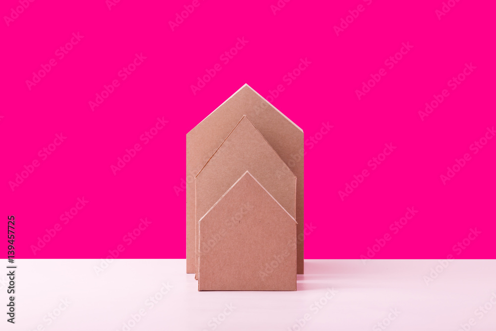 three house model cardboard with free copyspace house loan business concept