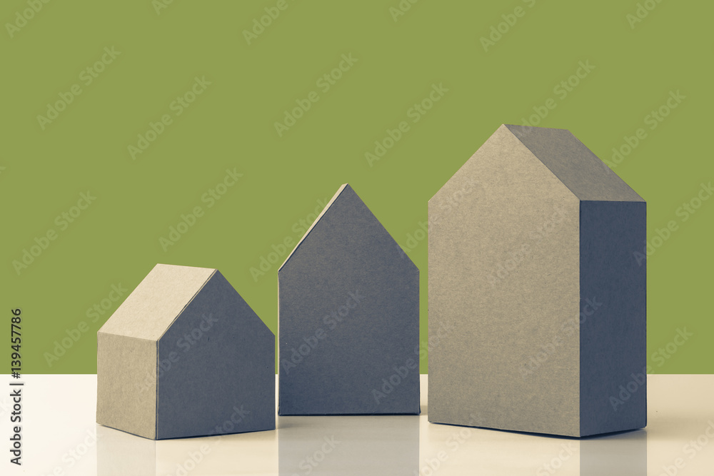 three house model cardboard with free copyspace house loan business concept