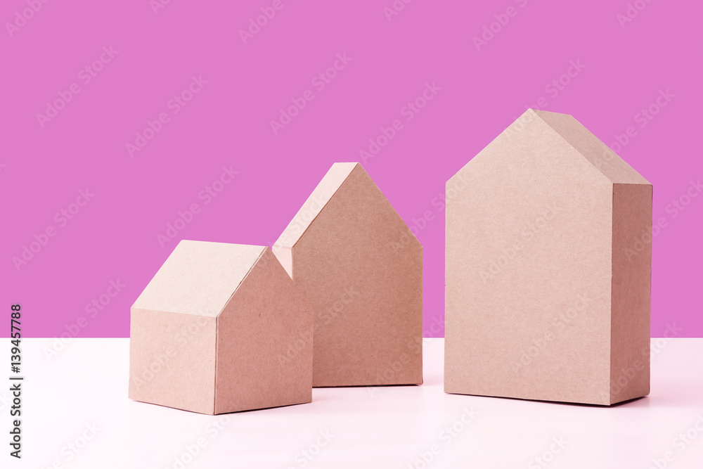 three house model cardboard with free copyspace house loan business concept