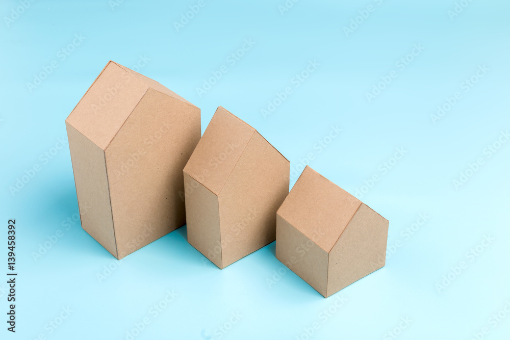 three house model cardboard with free copyspace house loan business concept