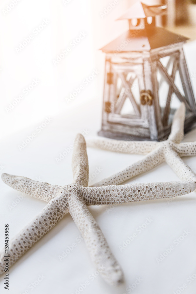 white starfish with vintage lantern summer ideas concept with free colyspace