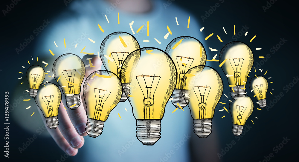 Businessman touching hand-drawn lightbulb with his finger