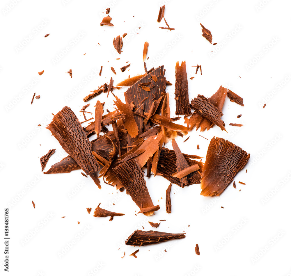 Chocolate chips and curls on white background. Top view.