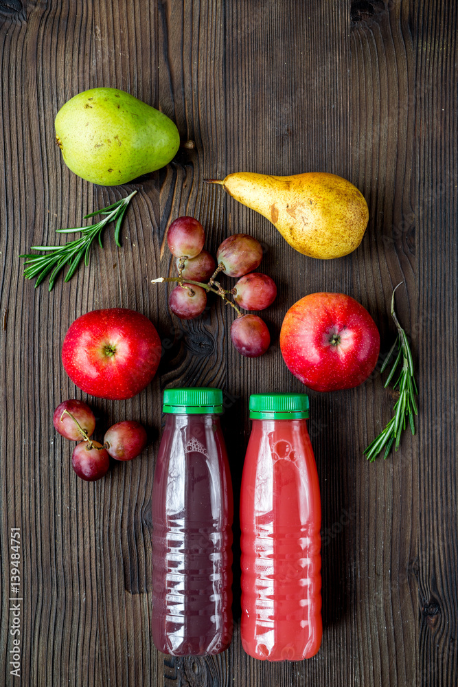 multifruit drink in plastic bottle on wooden background top view mockup