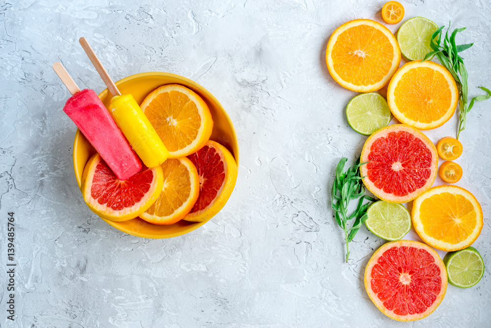 Orange icecream with fruits on table background top view mock-up