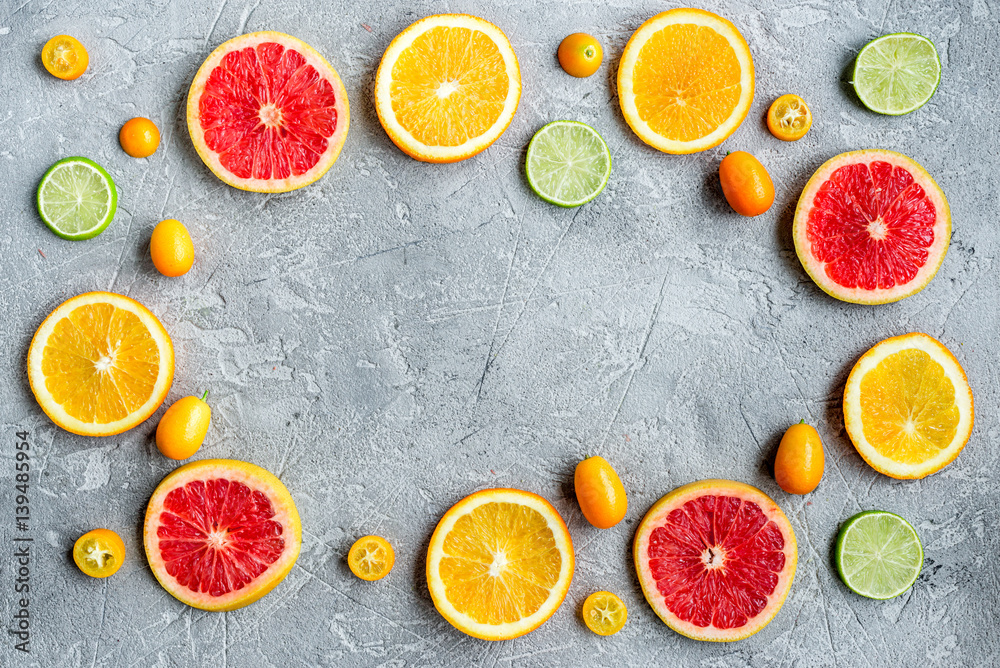 sliced citrus on stone table background top view mock up