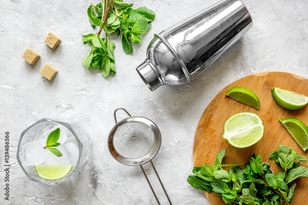 making mojito on stone background top view