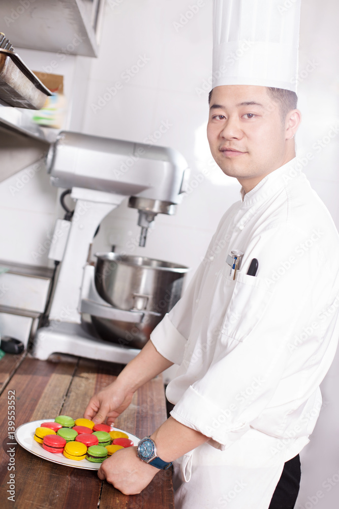 young man chelf makes food in kitchen