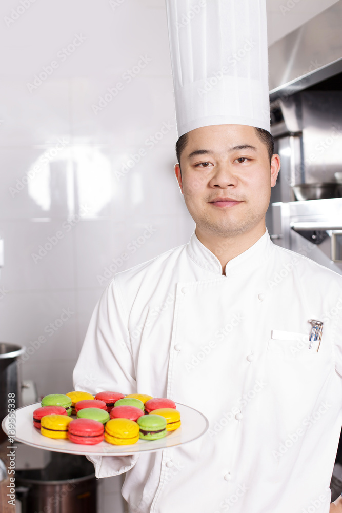 young man chelf makes food in kitchen