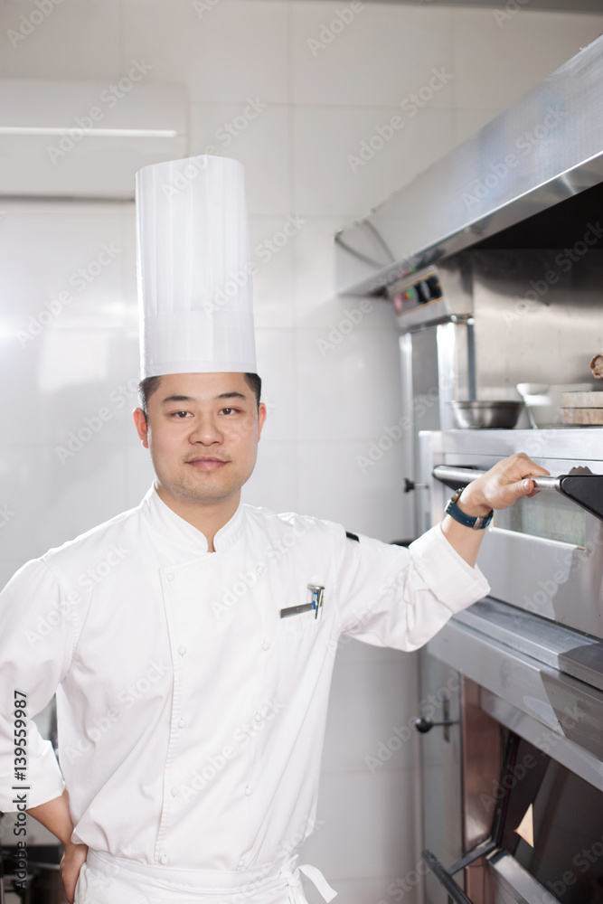 young man chelf in modern kitchen