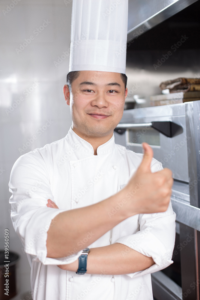 young man chelf in modern kitchen