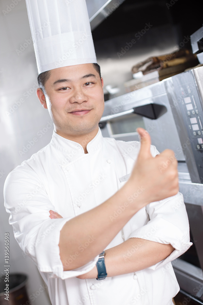 young man chelf in modern kitchen