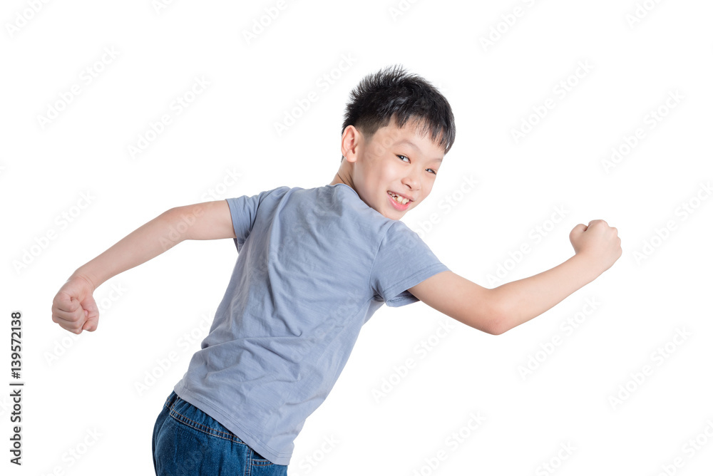 Young asian boy running over white background