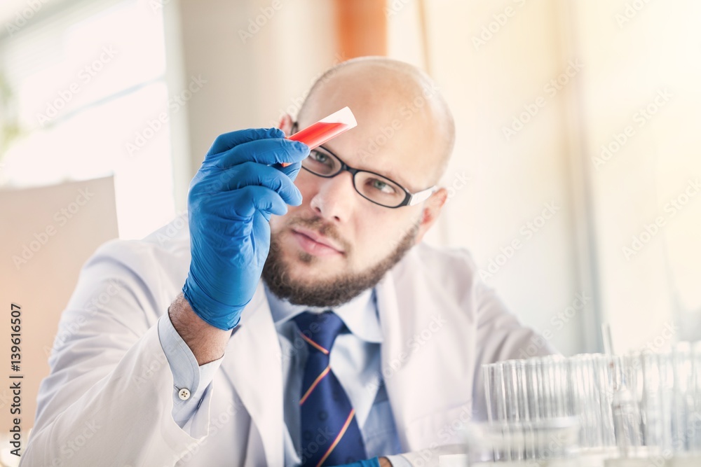 Man researcher carrying out scientific research.