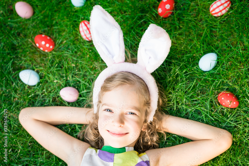 Easter bunny and eggs on green grass