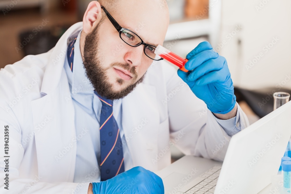 Man researcher carrying out scientific research.