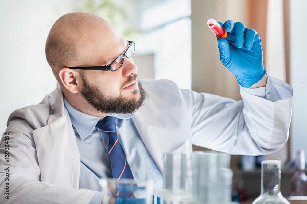 Man researcher carrying out scientific research.