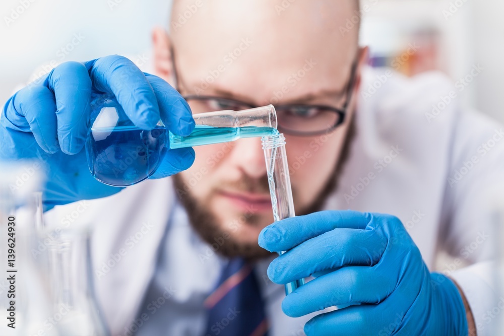 Man researcher carrying out scientific research.