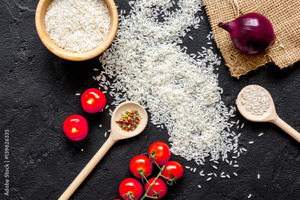 ingredients for paella on dark background top view