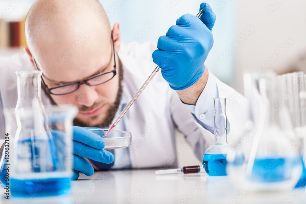 Man researcher carrying out scientific research.