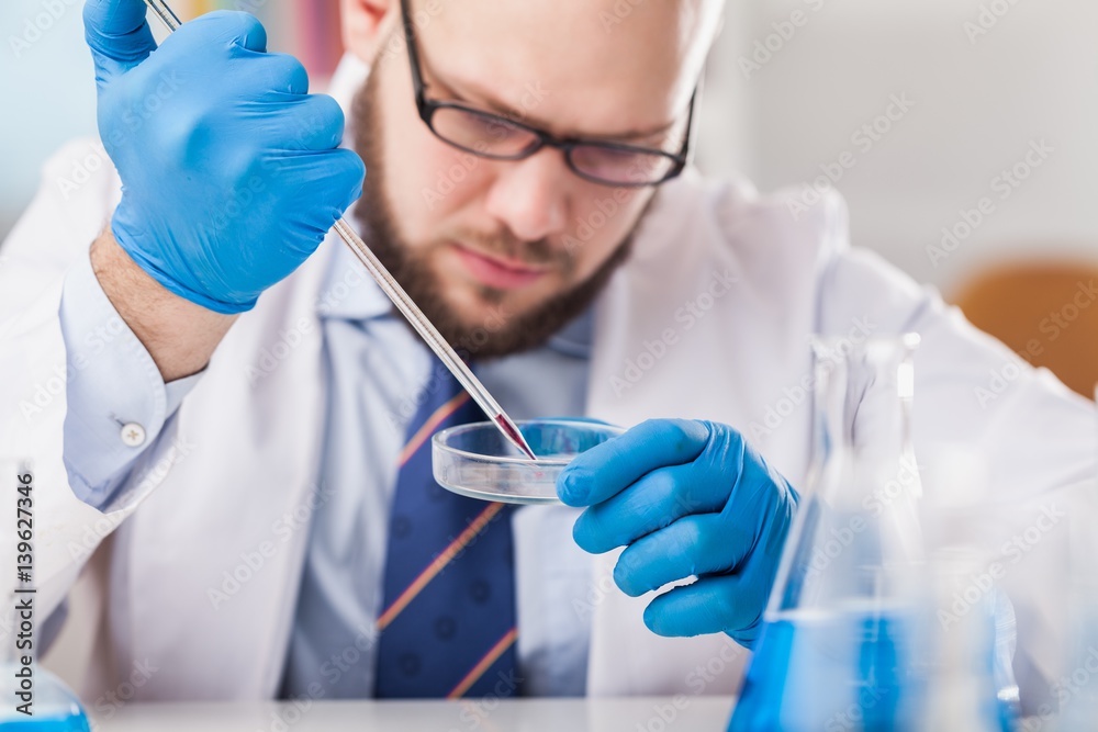 Man researcher carrying out scientific research.