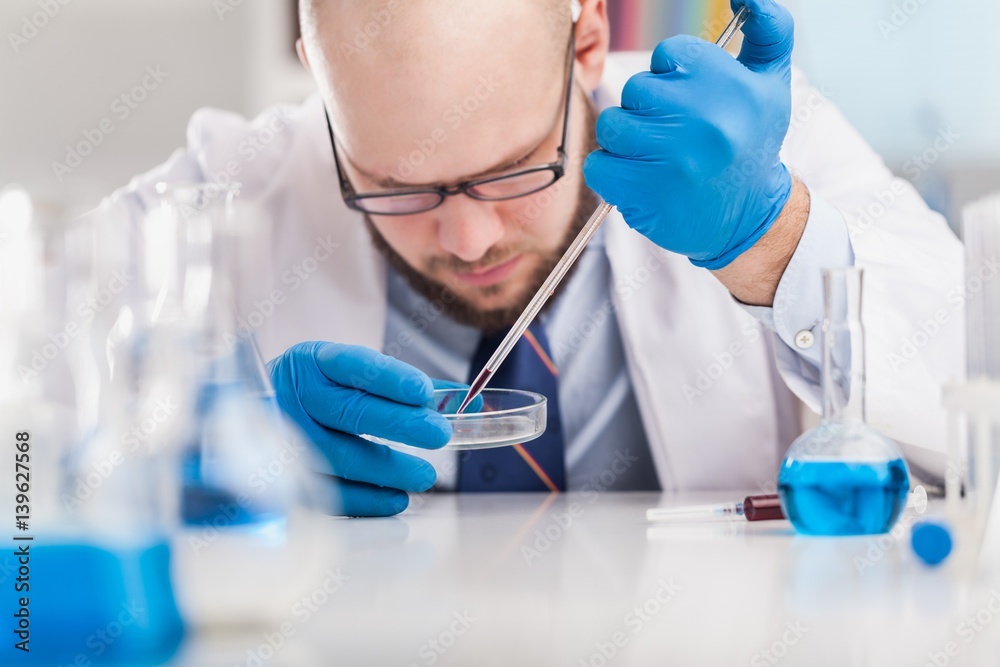 Man researcher carrying out scientific research.