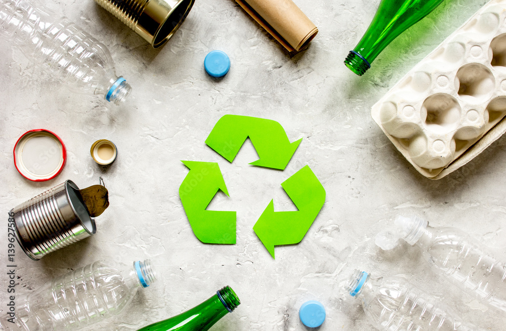 waste and recycling symbol in eco care on stone top view