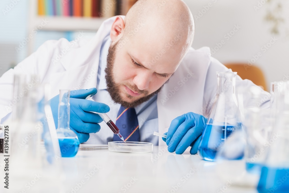 Man researcher carrying out scientific research.