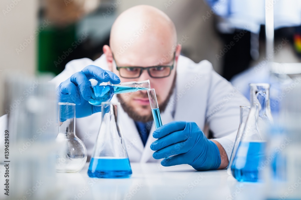 Man researcher carrying out scientific research.