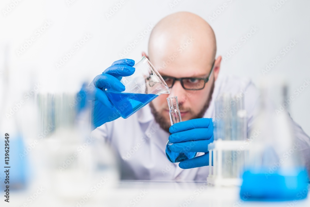 Man researcher carrying out scientific research.