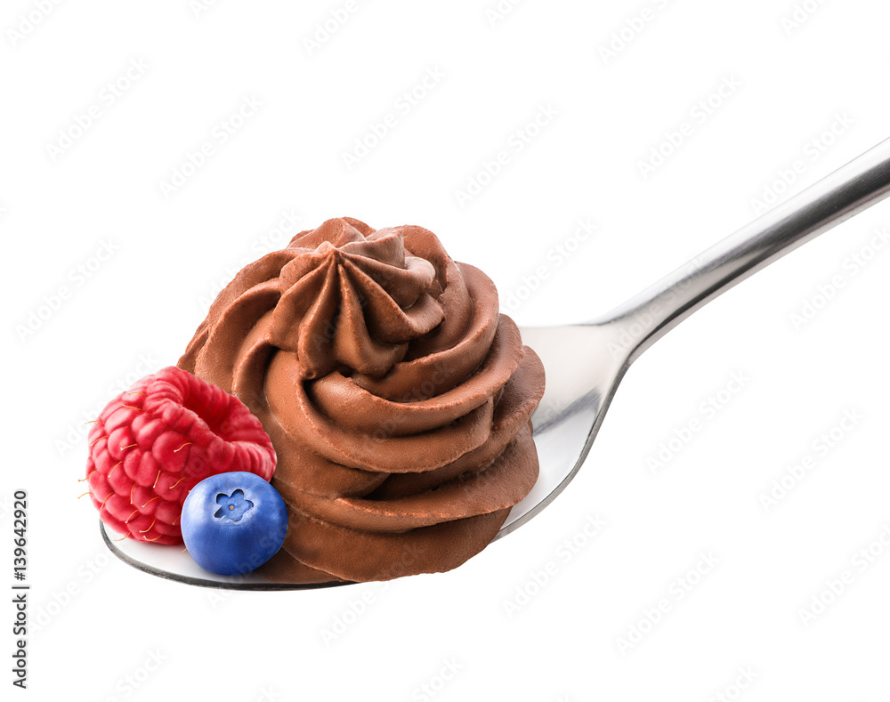 Chocolate frozen yogurt with fresh raspberry and blueberry on the spoon isolated by clipping path. W