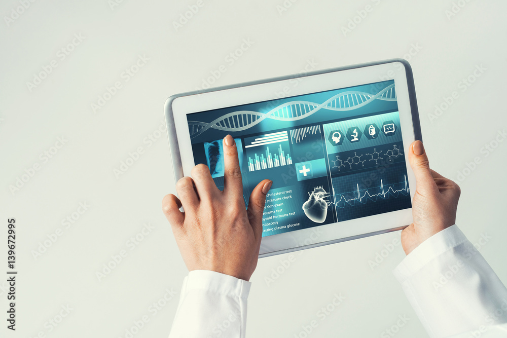 Close of female doctor hands working with tablet pc computer