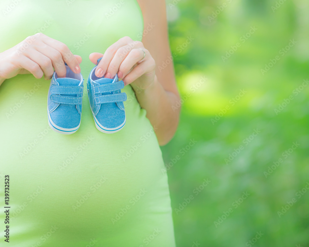 Beautiful belly of young pregnant woman