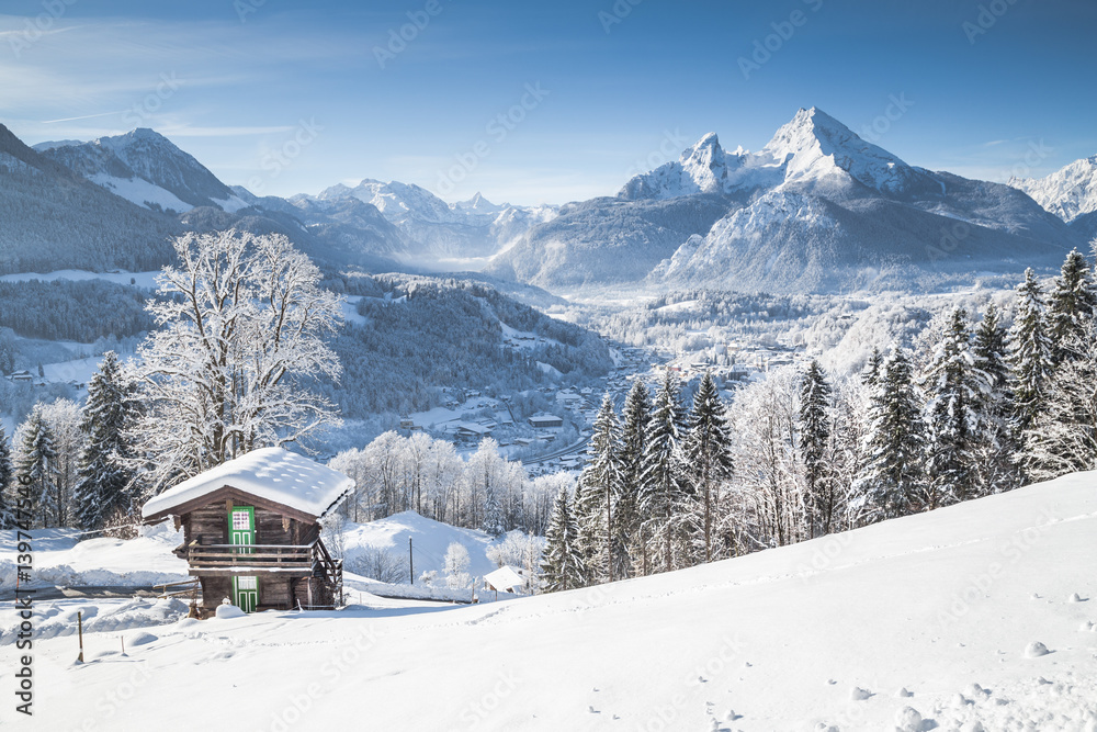 Winter wonderland in the Alps with traditional mountain chalet