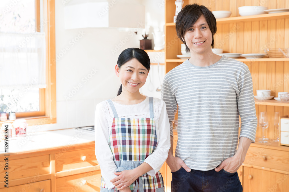 portrait of young asian couple in the kitchen