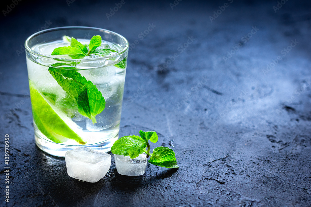 mojito in glass on dark background close up