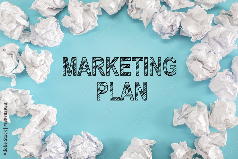 Marketing Plan text with crumpled paper balls