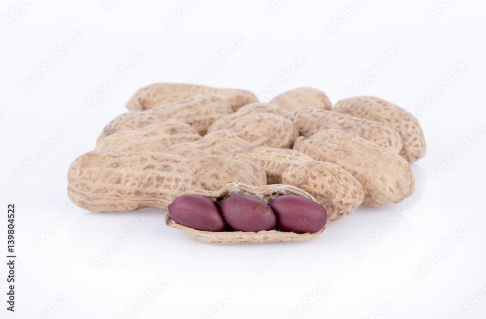 close up of roasted peanuts isolated on white