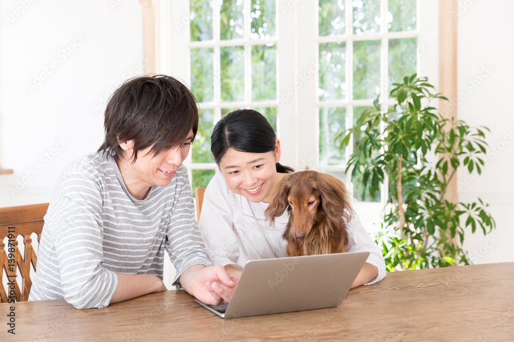 young asian couple using laptop computer