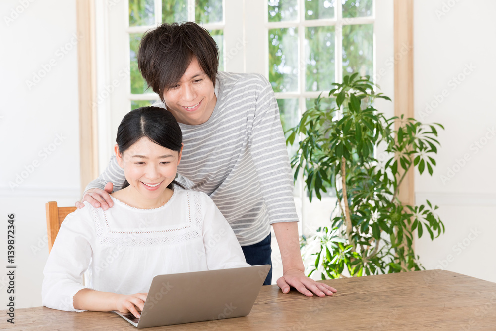 young asian couple using laptop computer