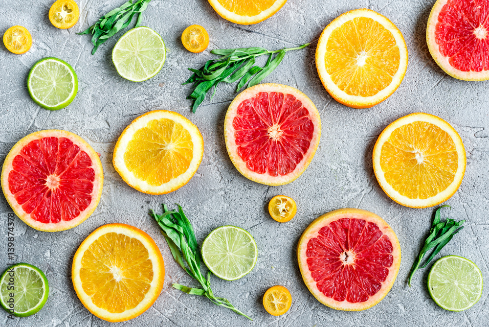 sliced citrus pattern on stone table background top view