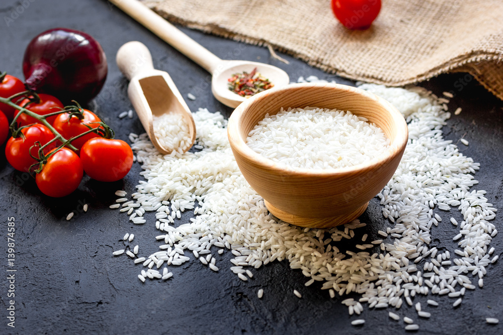 ingredients for paella on dark background