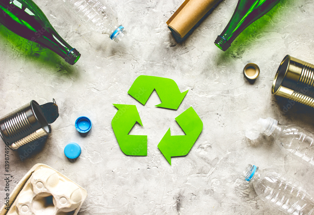 Eco concept with recycling symbol on table background top view