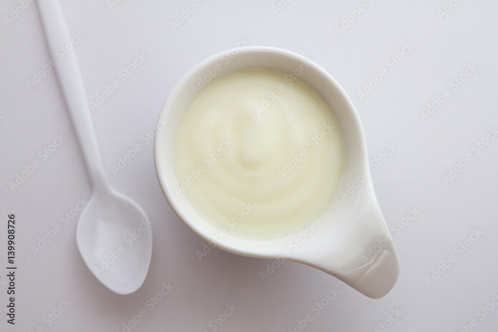 Close up natural creamy white yogurt in cup