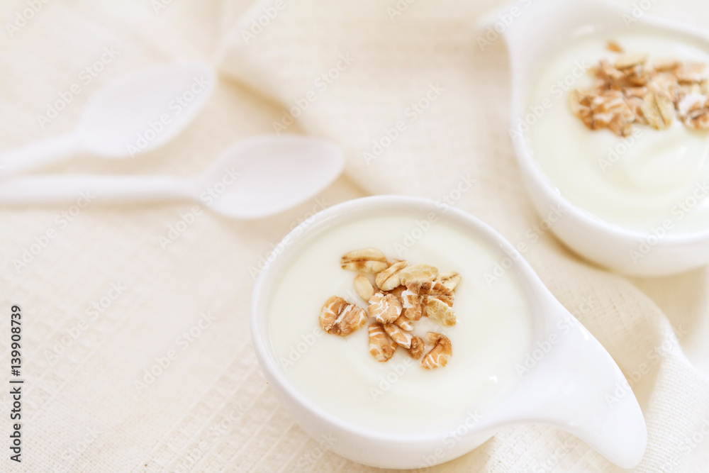 Close up natural creamy white yogurt in cup