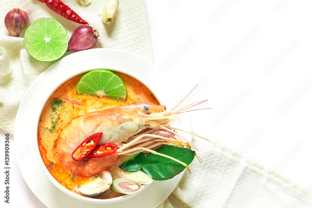 Close up Asian Spicy soup with shrimp in white bowl , famous Thai food cuisine calling Tom Yum Kung