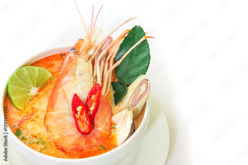 Close up Asian Spicy soup with shrimp in white bowl , famous Thai food cuisine calling Tom Yum Kung