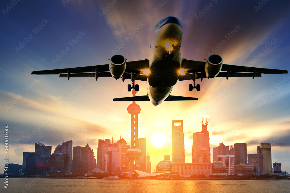 airplane, background of the shanghai skyline