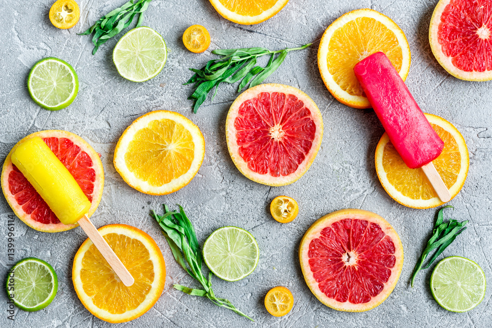 Orange icecream with fruits on table background top view pattern